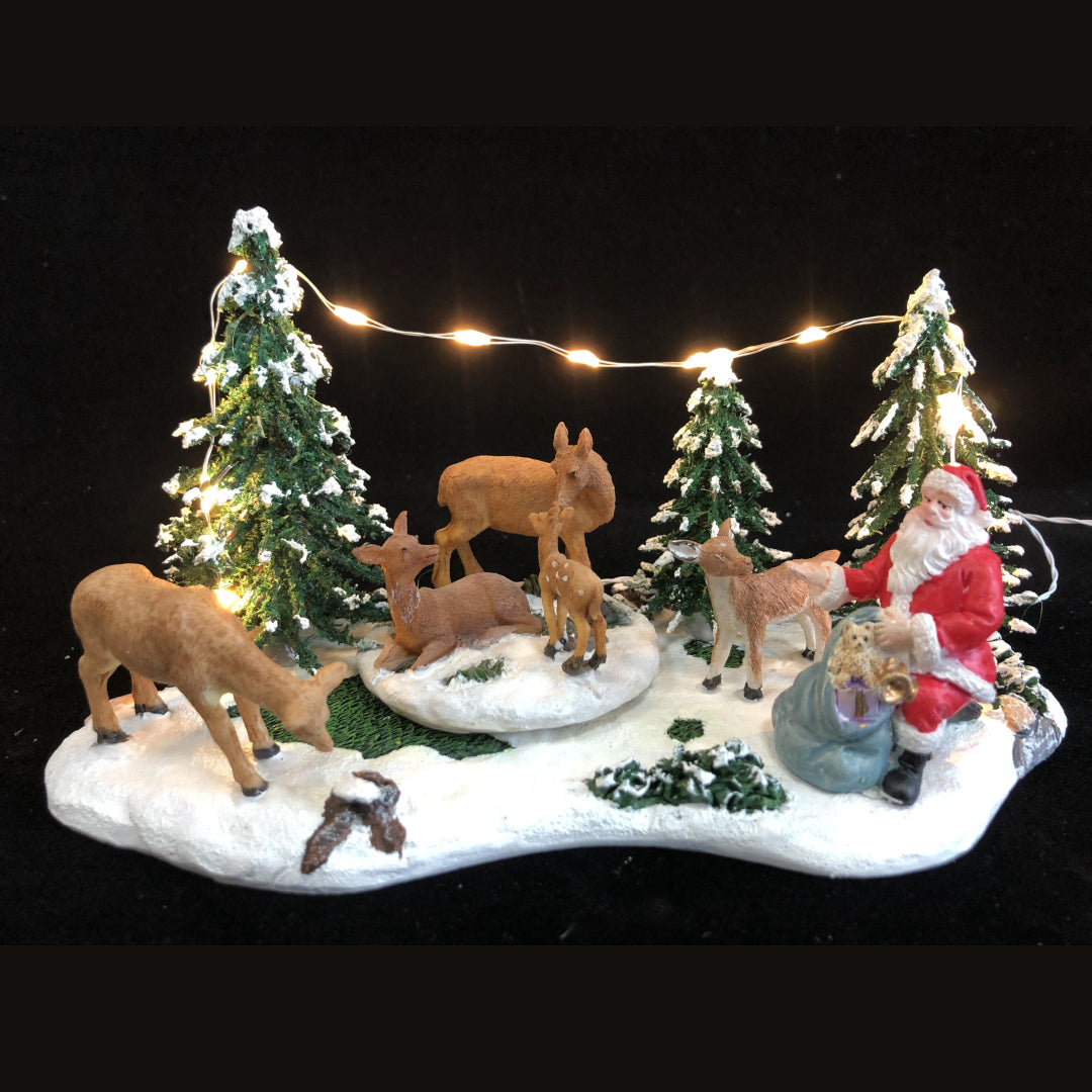 Miniatura luminosa con Babbo Natale - Babbo Natale nel bosco