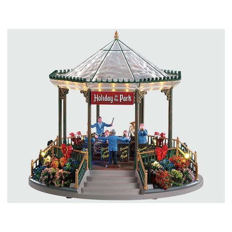 LEMAX GIOSTRA IN MOVIMENTO HOLIDAY GARDEN GREEN BANDSTAND 94551 Casette Illuminate LEMAX