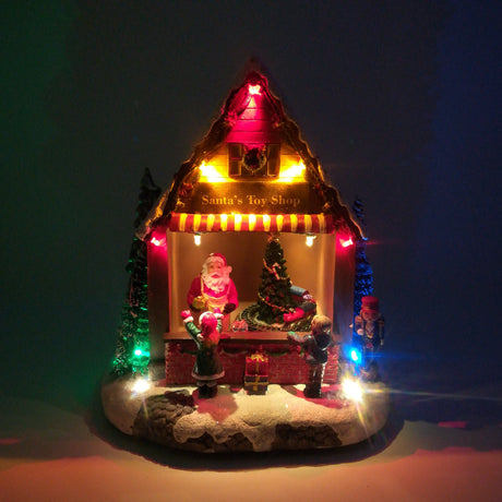 Negozio di Giocattoli di Babbo Natale con Treno che Gira a Batteria Paesaggi e Scene Natalizie Garden Team