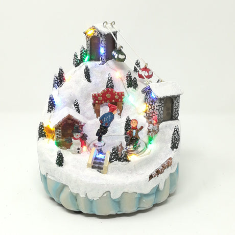 Villaggio con Sciatori e Funivia Paesaggi e Scene Natalizie Garden Team