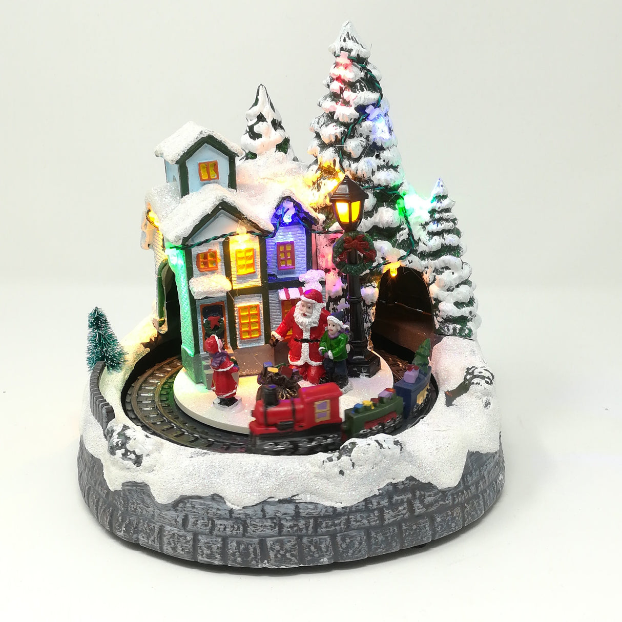 Villaggio con Treno che Gira nel Tunnel Babbo Natale con Bimbi Paesaggi e Scene Natalizie Garden Team