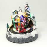 Villaggio con Treno che Gira nel Tunnel Babbo Natale con Bimbi Paesaggi e Scene Natalizie Garden Team